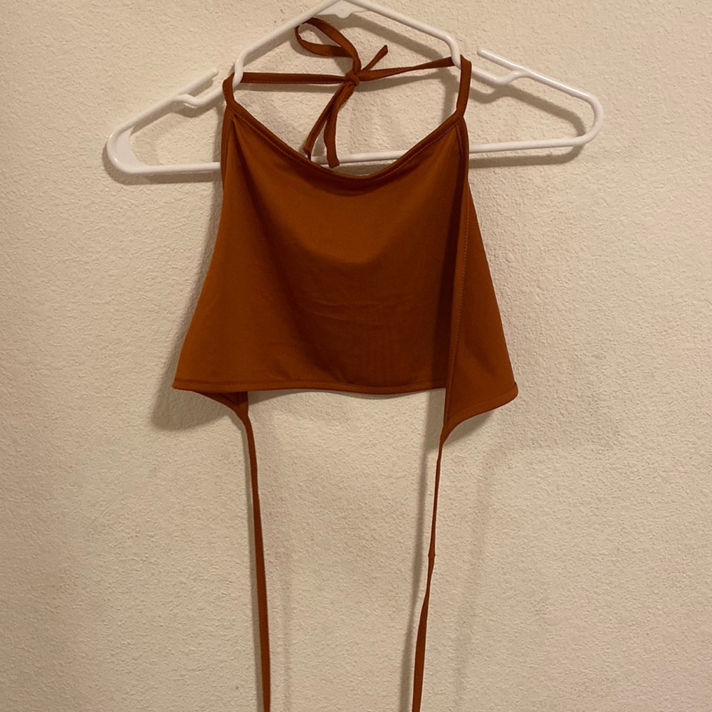 Orange open back tie tank top.